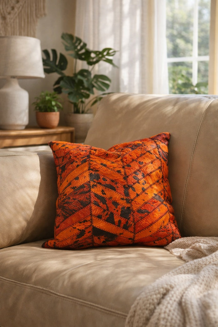 Handcrafted orange and black cowhide cushion cover for living room