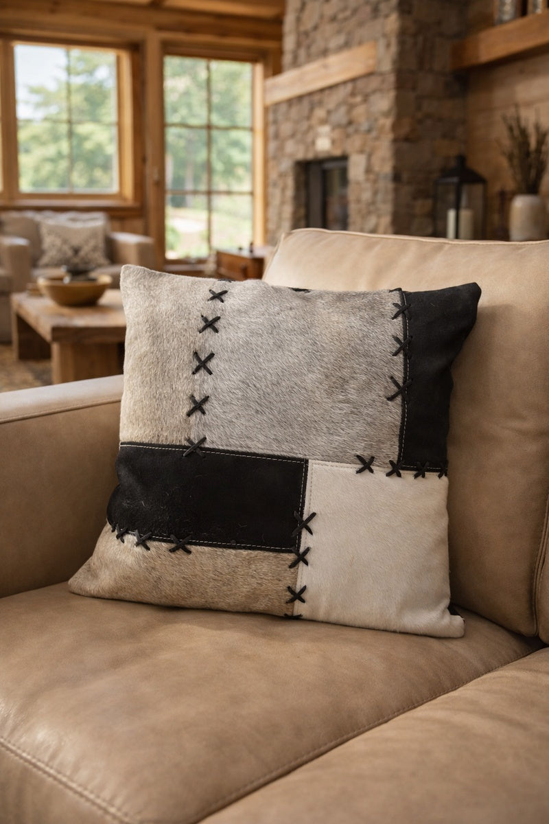Patchwork cowhide cushion cover 45x45cm in black, grey and cream with X-stitch detailing