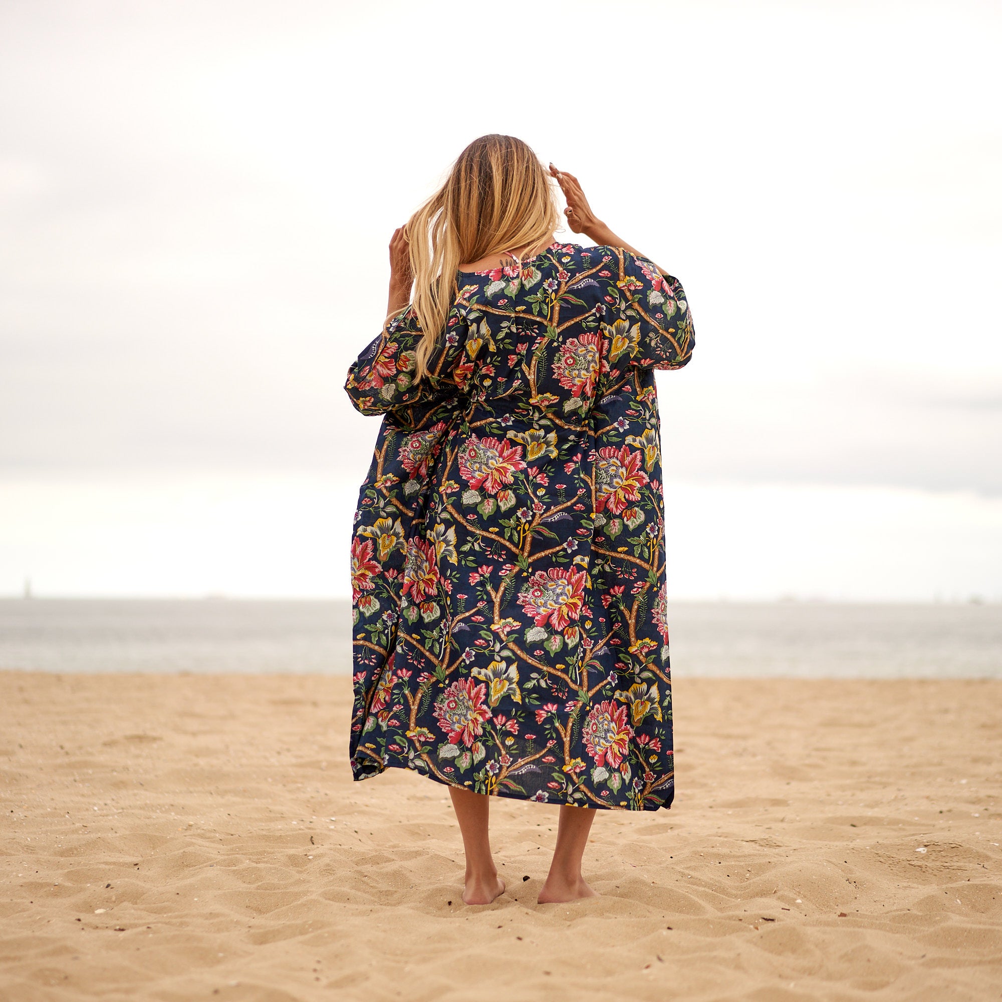 Watercolor blue floral kaftan European summer outfit women
Oversized cotton kaftan travel wardrobe essential
Soft blue floral kaftan beach styling outfit women
Resort wear watercolor kaftan coastal chic aesthetic