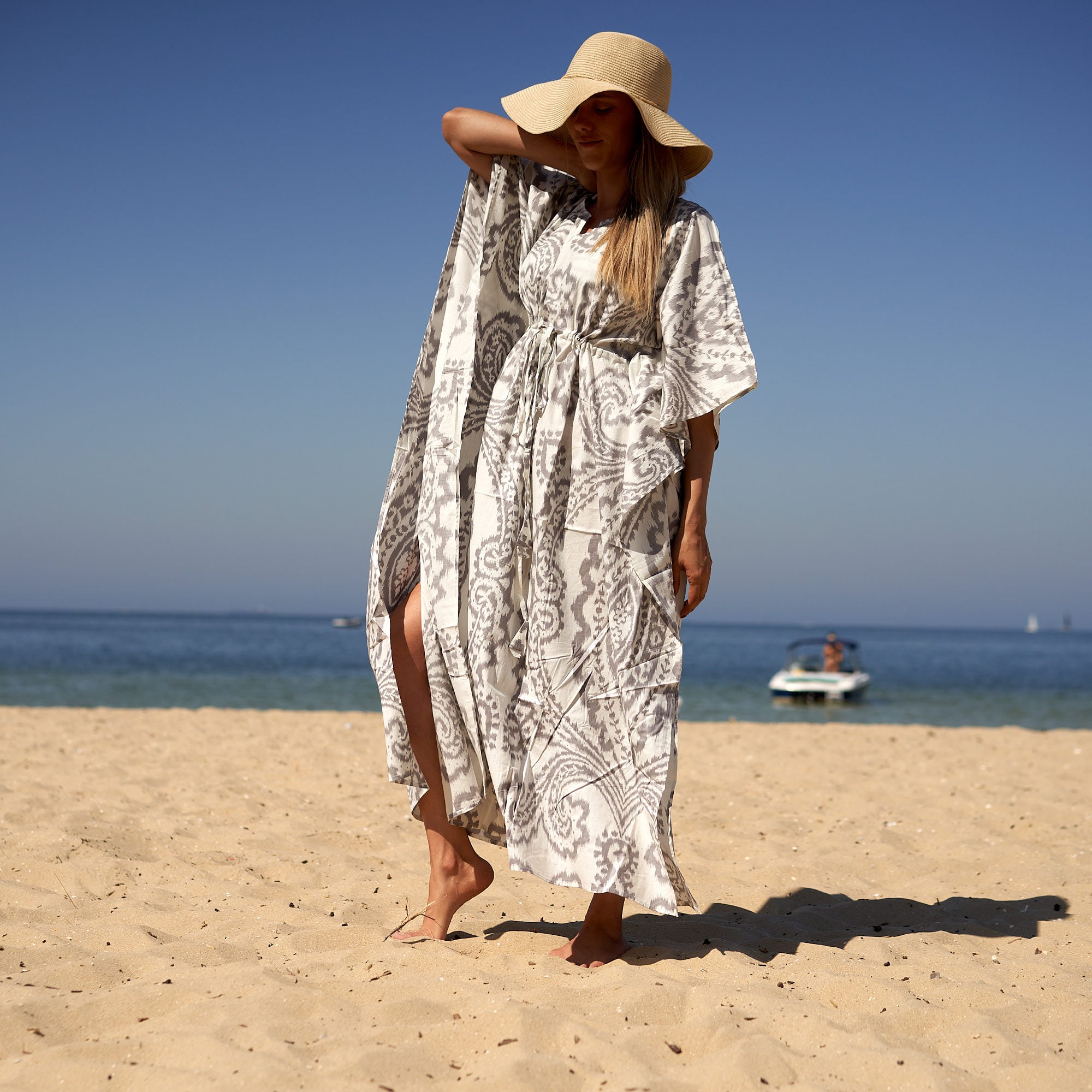 Flowy floral cotton kaftan with oversized relaxed silhouette
Luxury cotton beach cover up for women in soft breathable fabric
Coastal boho cotton kaftan styled for beach-to-dinner outfits