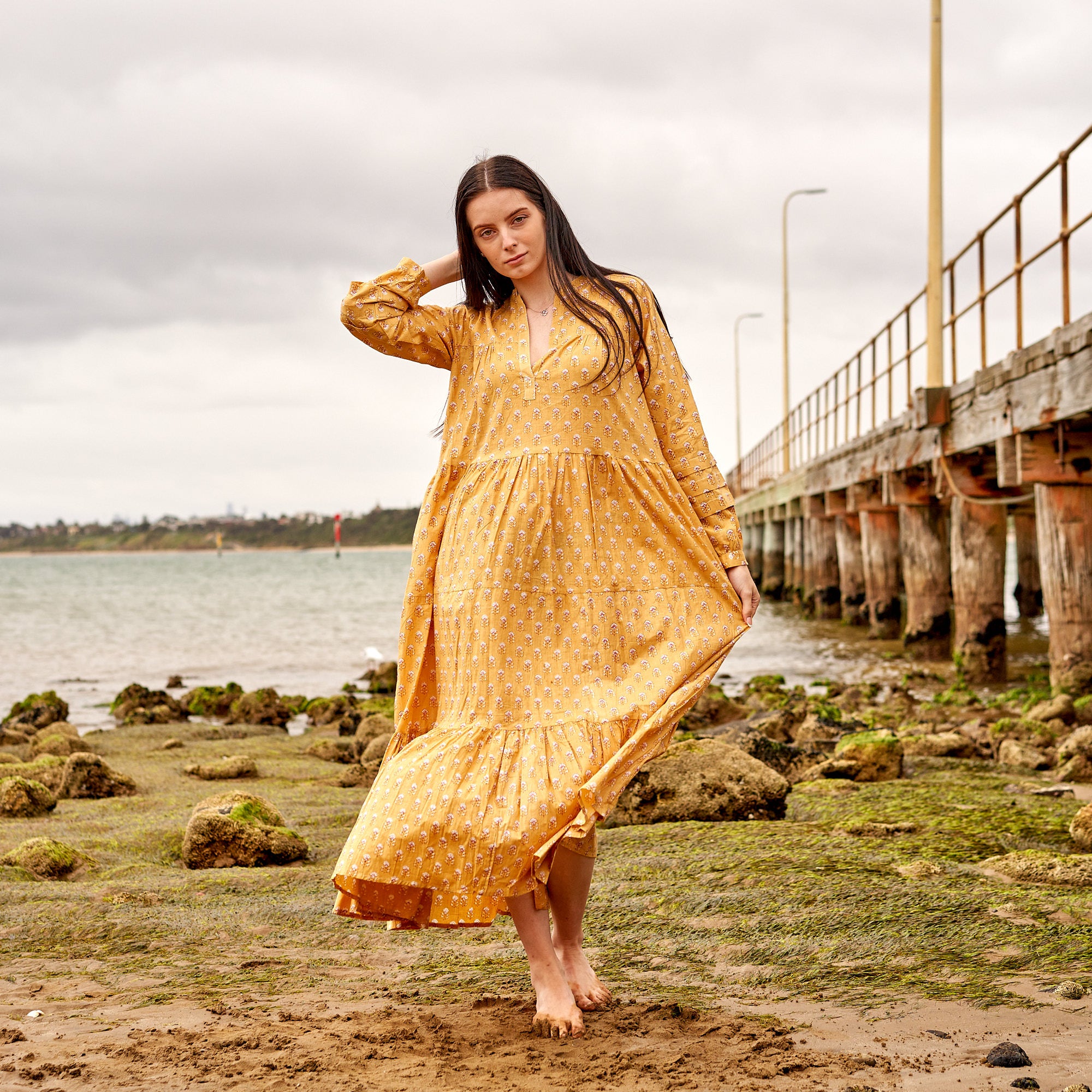 Mustard boho maxi dress with floral block print, lightweight cotton summer outfit
Airy cotton maxi dress in mustard tone, perfect for beach and resort wear
Bohemian maxi dress in mustard with flowy silhouette, relaxed summer style