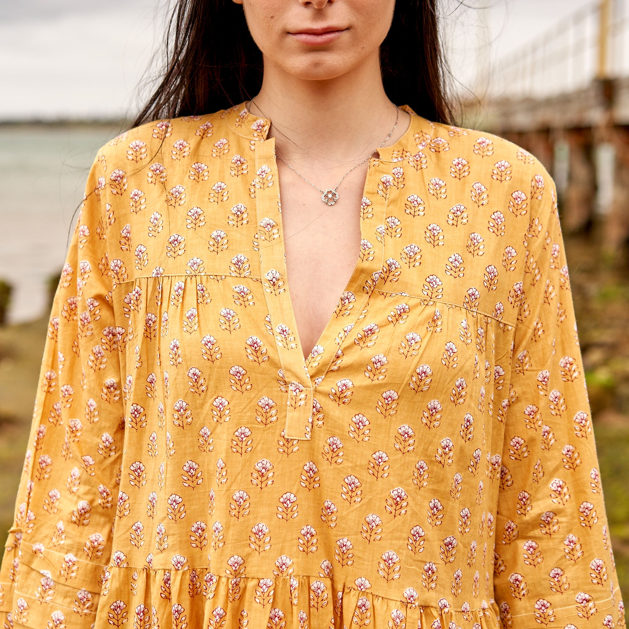 Handcrafted cotton maxi dress with block print design, airy summer fashion.
Long sleeve mustard cotton maxi dress, effortless boho style for everyday wear.