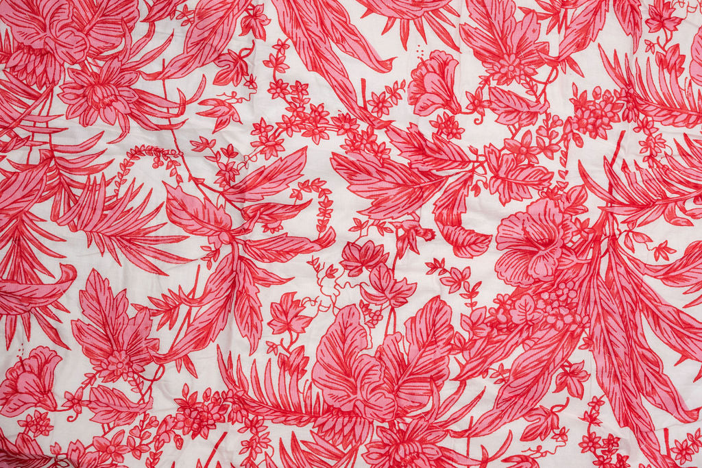 Red floral pattern on a white background