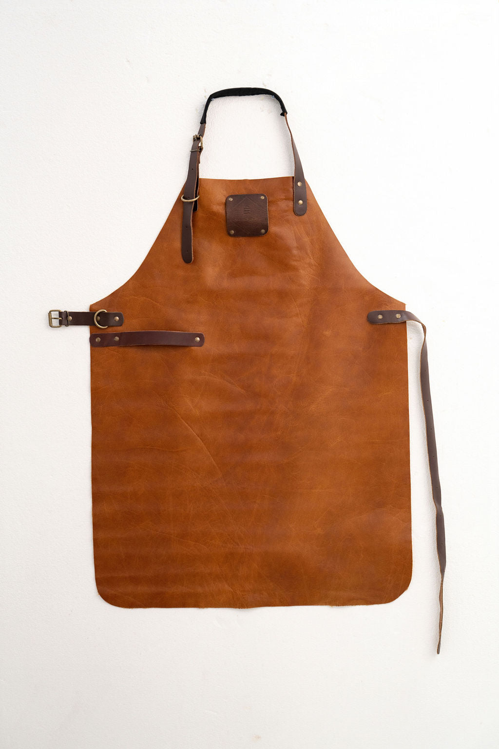 Stylish vintage saddle brown leather apron with adjustable straps
