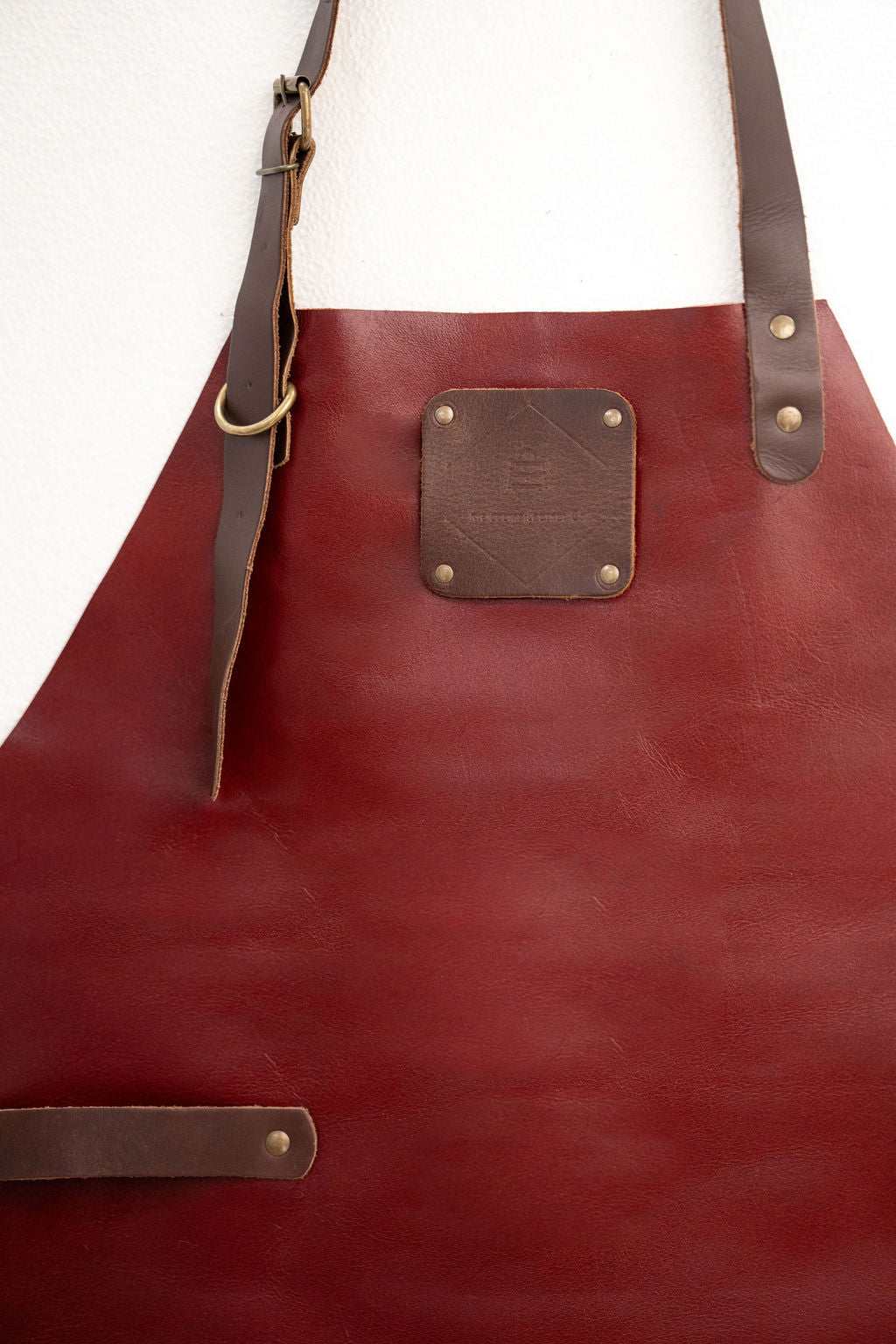 Durable red leather apron with clean minimal style for professionals