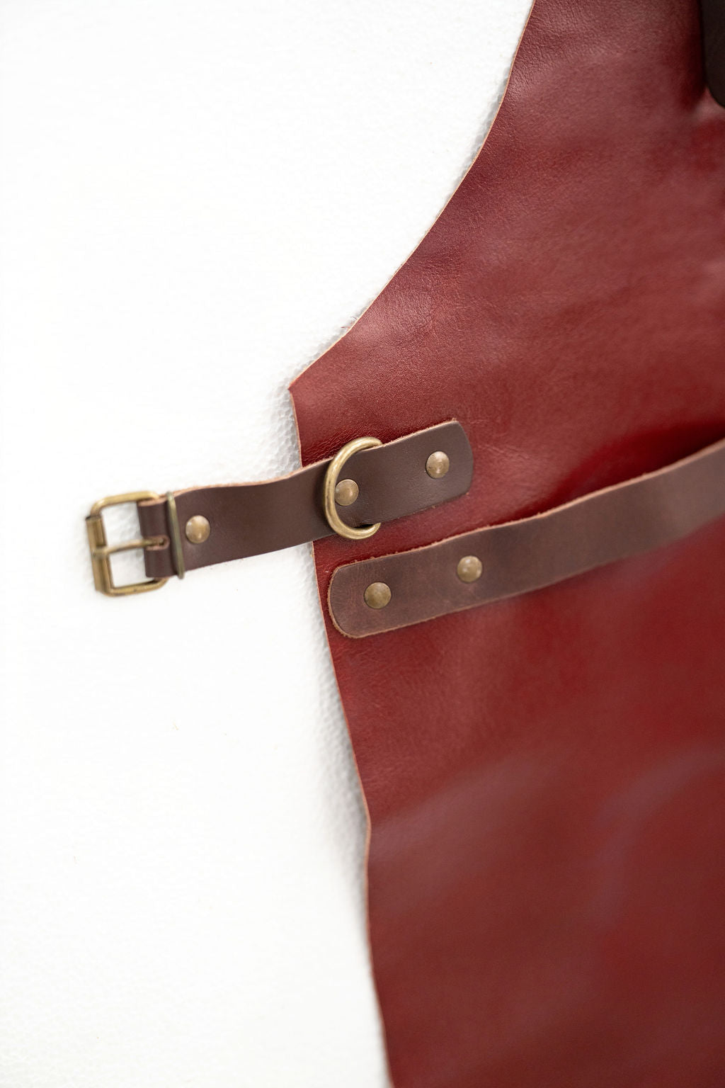 Heavy duty red leather apron with minimal design and full coverage