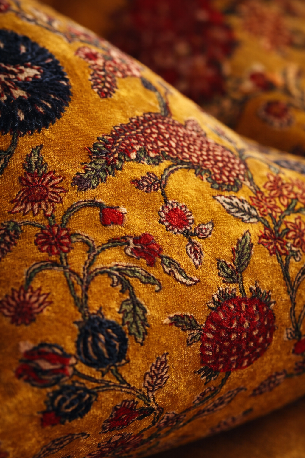 close-up of velvet cushion showing detailed floral pattern texture