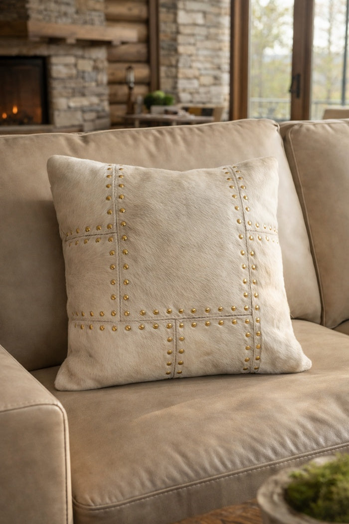 Modern ivory cowhide leather cushion cover with brass stud trim for living room