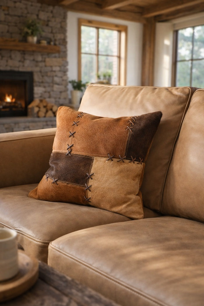 Luxury tan and chocolate cowhide leather cushion cover as a stylish home accent