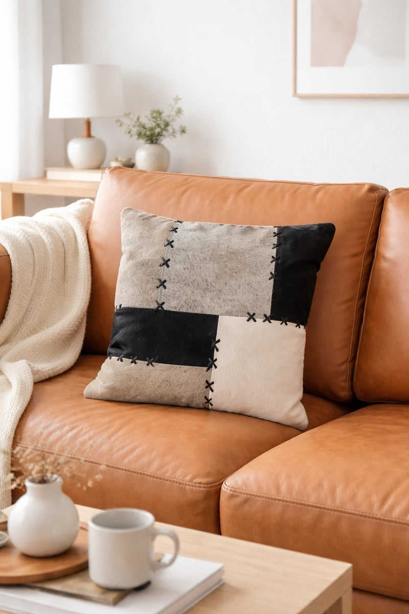 Neutral cowhide cushion cover with decorative X-stitch detail, 45x45cm square