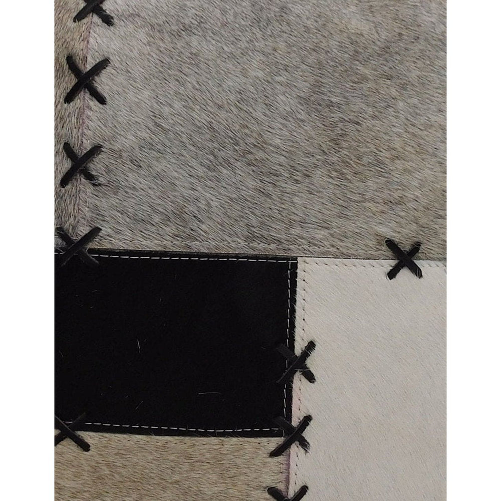 Premium 45x45 cowhide cushion cover with geometric patchwork and X-stitch accents