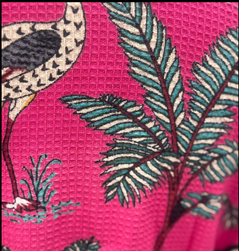 Floral pattern with a flamingo on a pink background