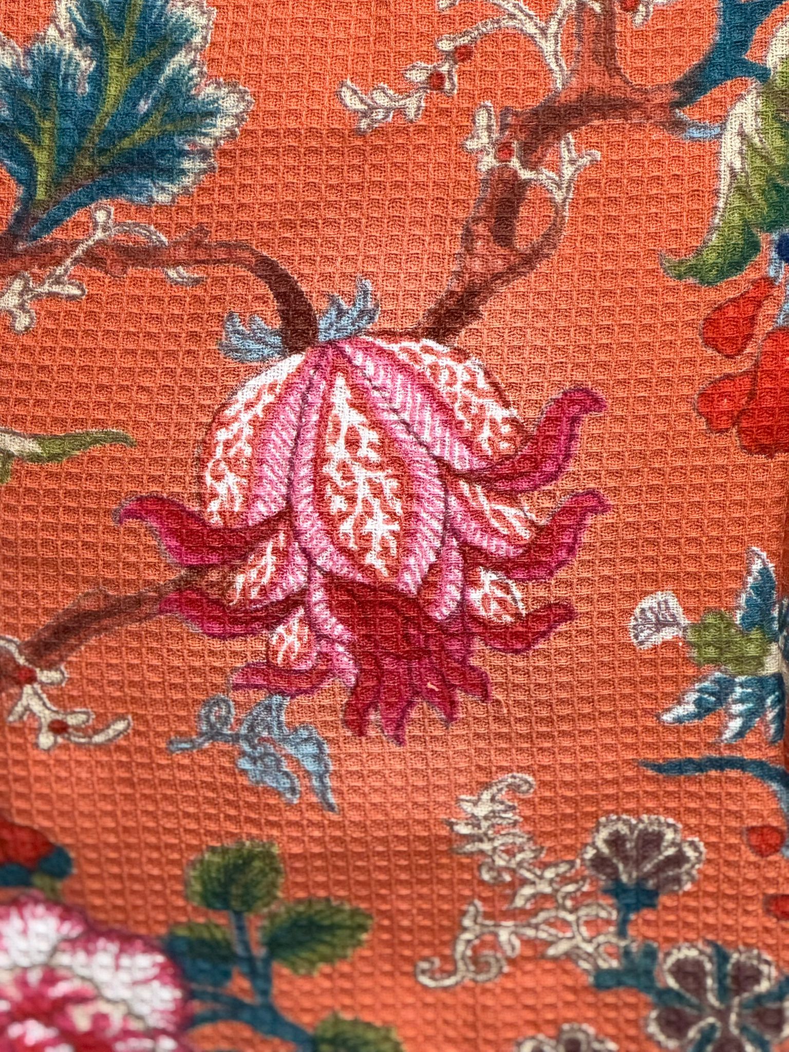 Side angle of floral orange cotton kimono with hand block printed design