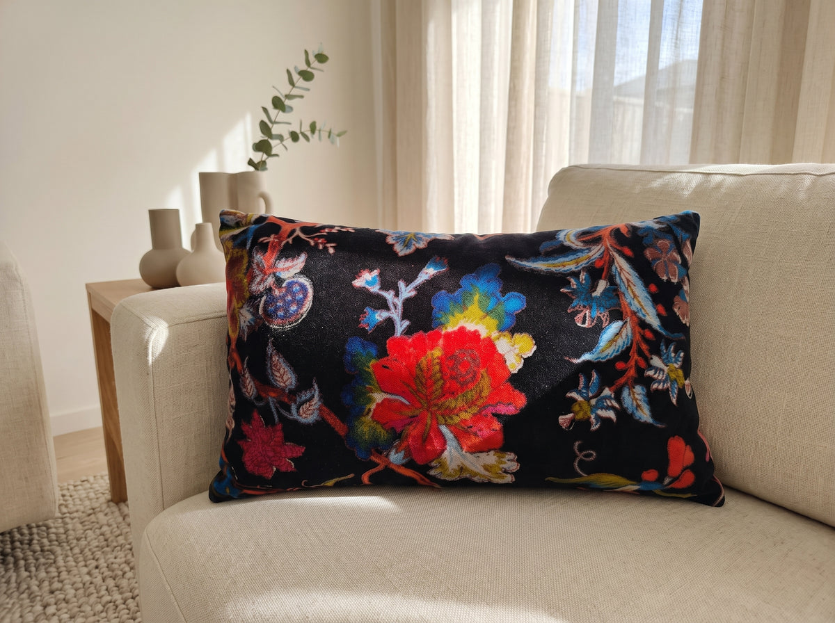 Botanical velvet lumbar cushion cover styled on tan leather sofa